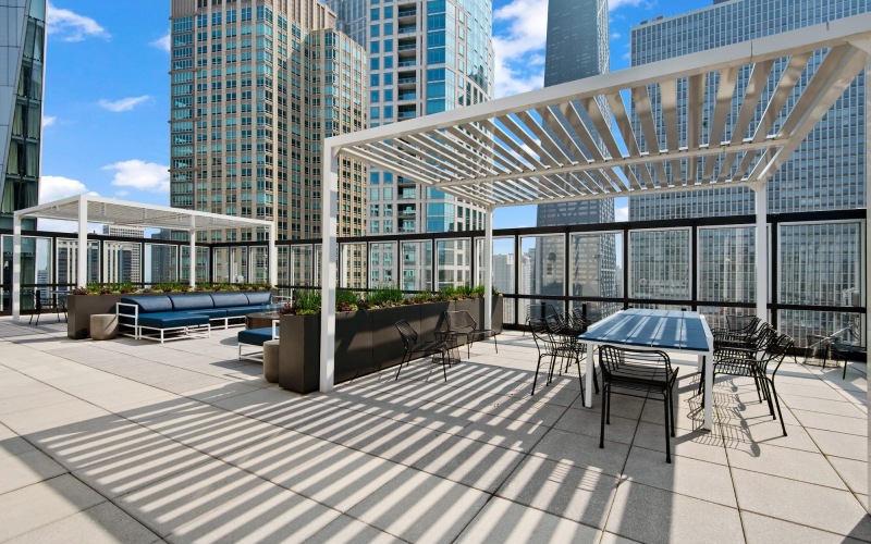 a courtyard with tables and chairs
